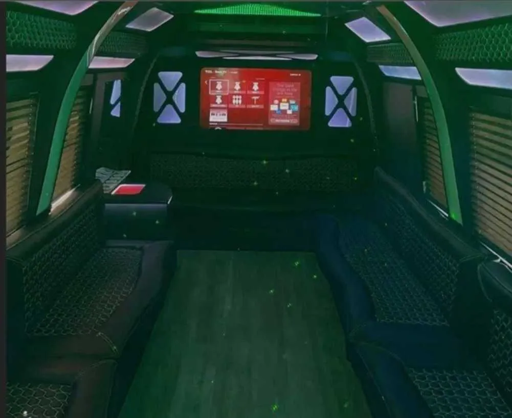 D-Town Bus for party bus rental: seating area, with perimeter lounge seating, window shades and LED accent lighting D-Town Bus for party bus rental: seating area, with perimeter lounge seating, window shades and LED accent lighting