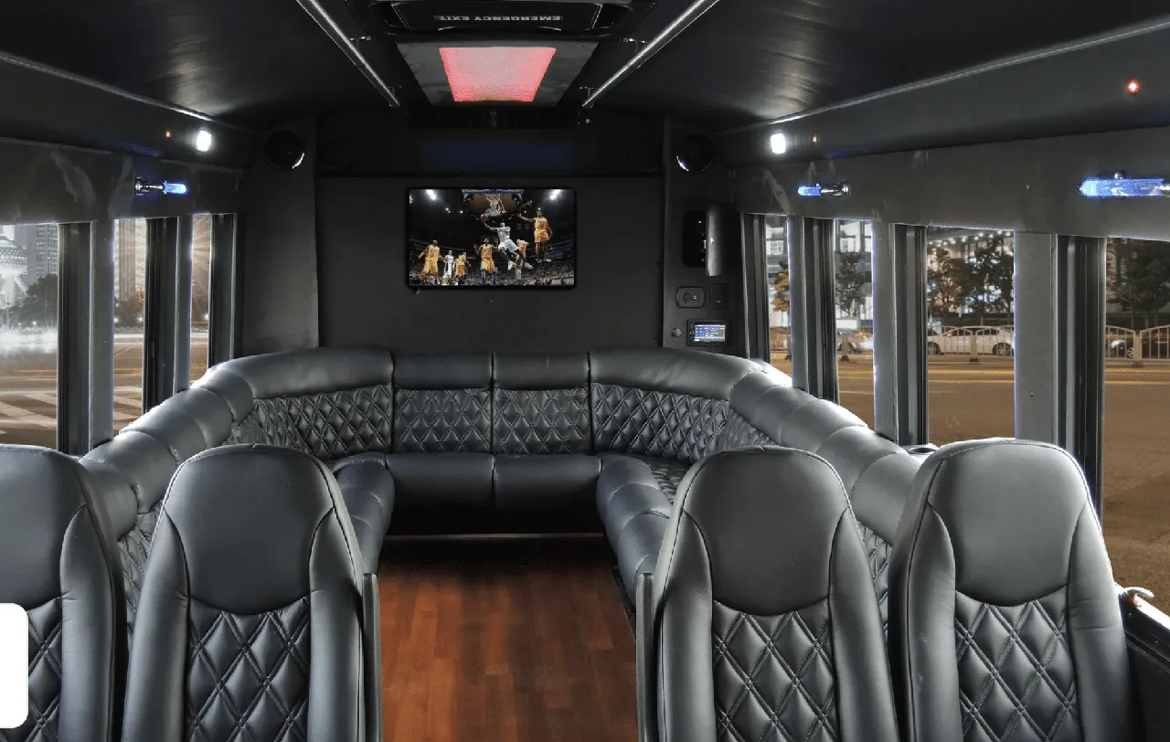 Limousine Coach for party bus rental: seating area, with perimeter lounge seating, sofa-style seating and wood-look flooring Limousine Coach for party bus rental: seating area, with perimeter lounge seating, sofa-style seating and wood-look flooring