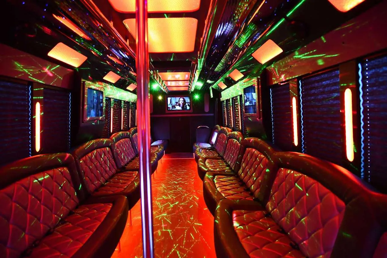 50 Passenger Party Bus: seating area, with perimeter lounge seating, window shades and LED accent lighting 50 Passenger Party Bus: seating area, with perimeter lounge seating, window shades and LED accent lighting